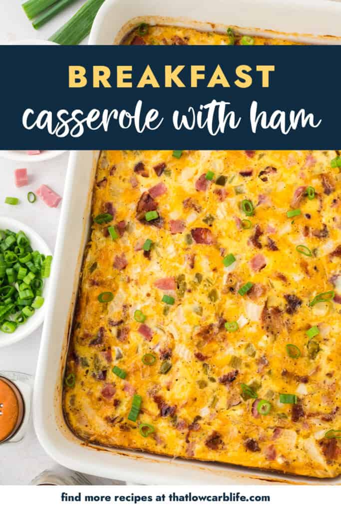 Breakfast casserole with ham in white baking dish.