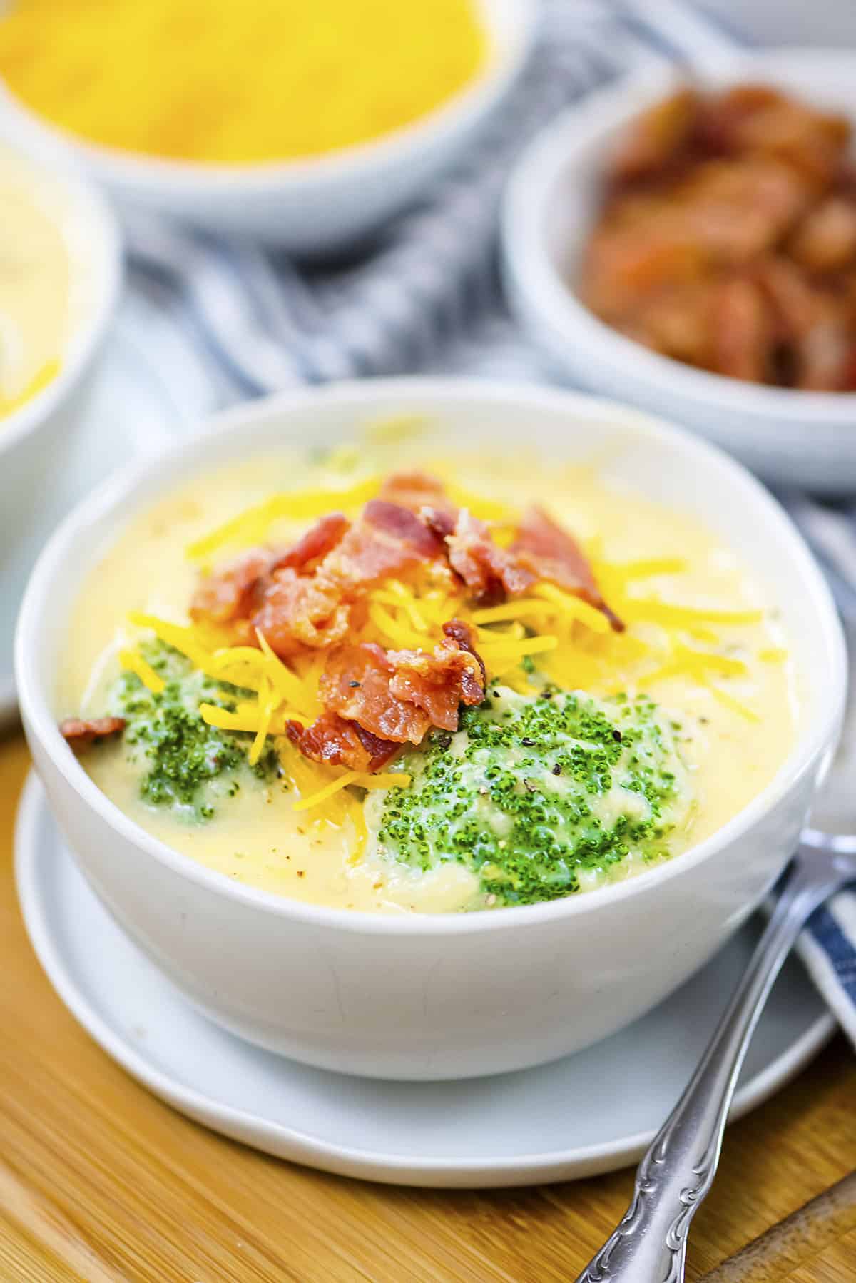 White bowl full of cauliflower broccoli soup.