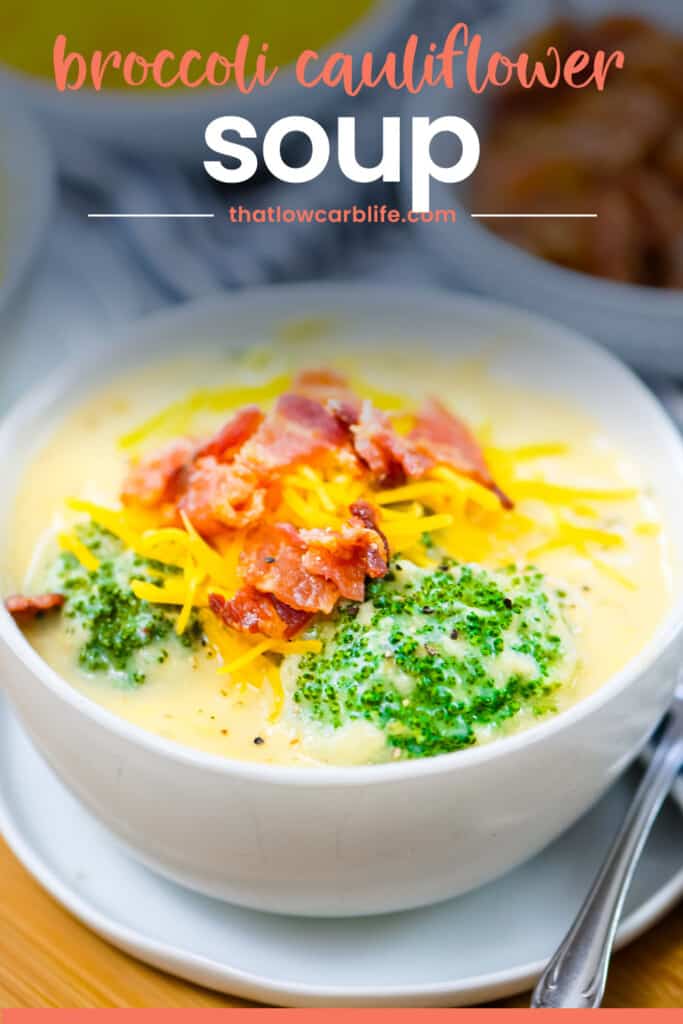 Bowl of soup topped with cheddar and bacon.