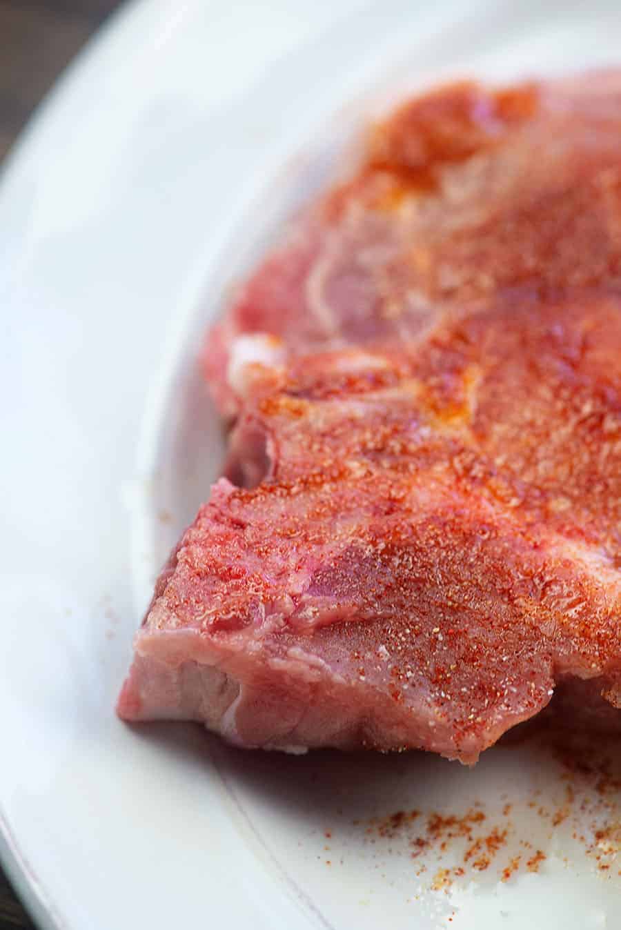 seasoned pork chops on a plate