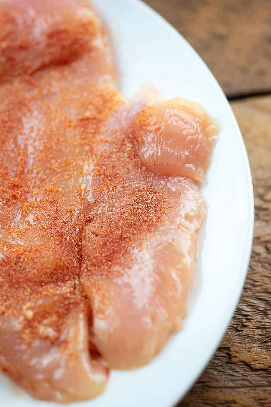 seasoned chicken breasts on white plate