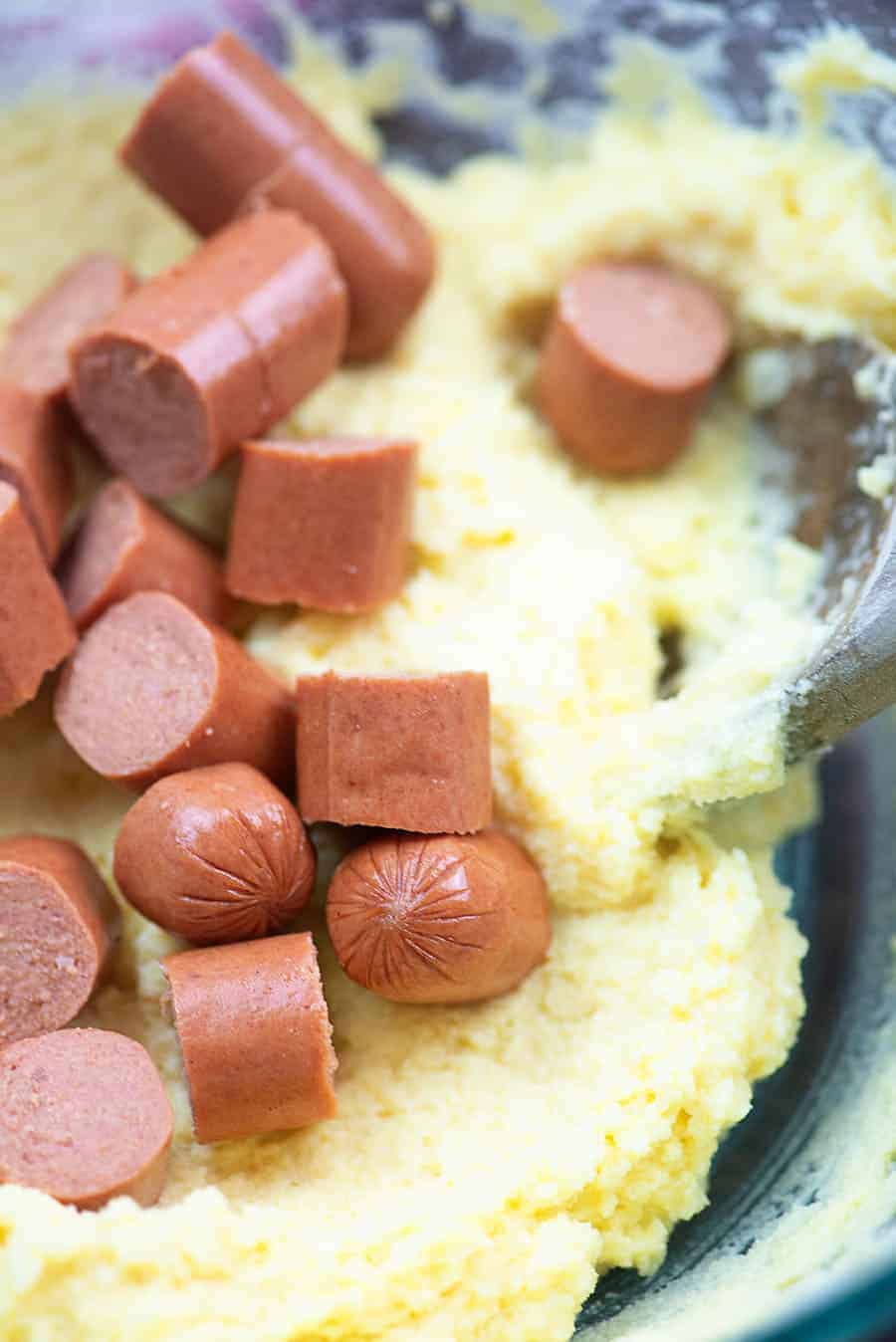 raw cut up corn dogs in a low carb  corn bread batter