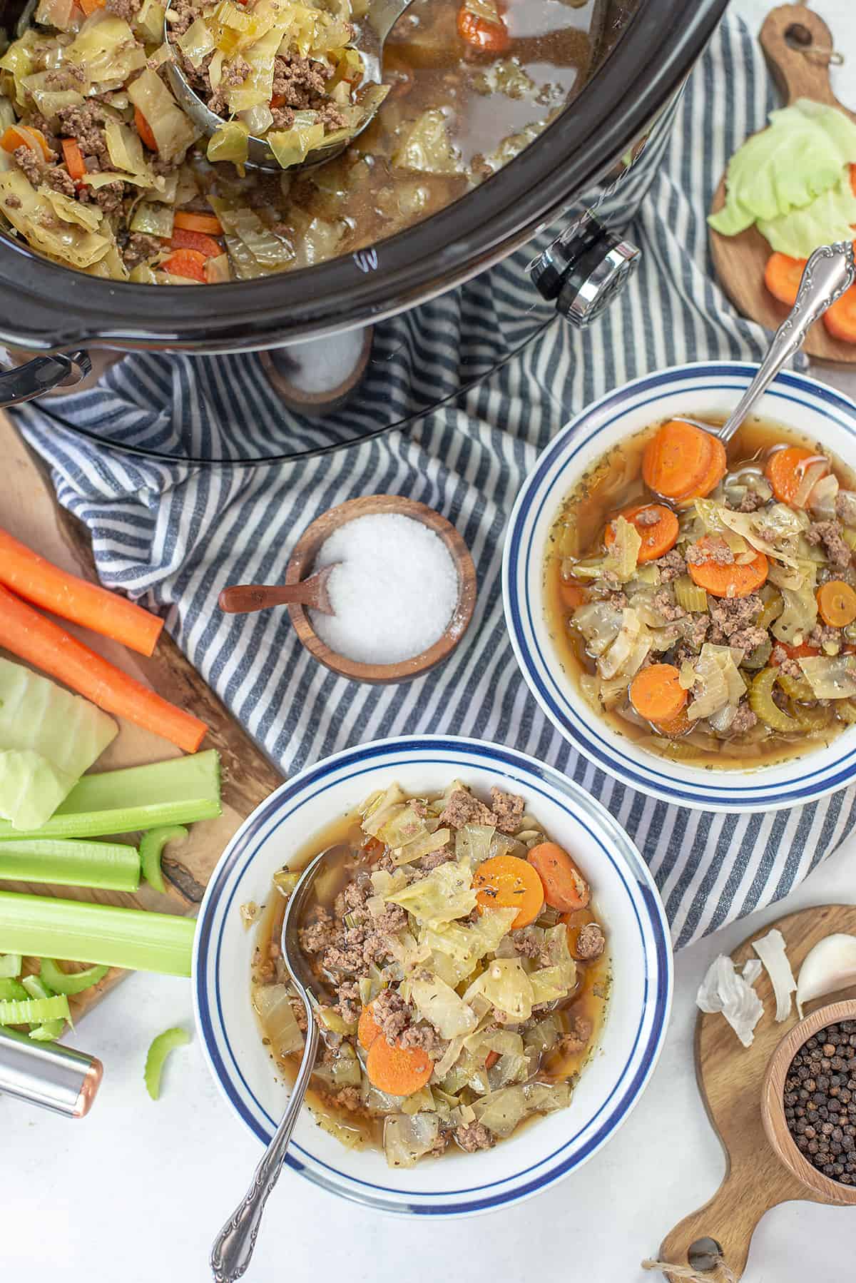 overhead view of crockpot cabbage soup with hamburger.