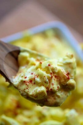 egg salad on a wooden spoon