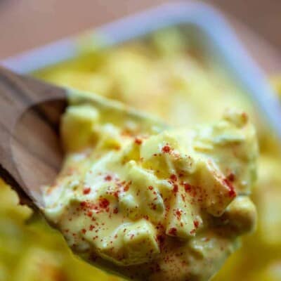 egg salad on a wooden spoon