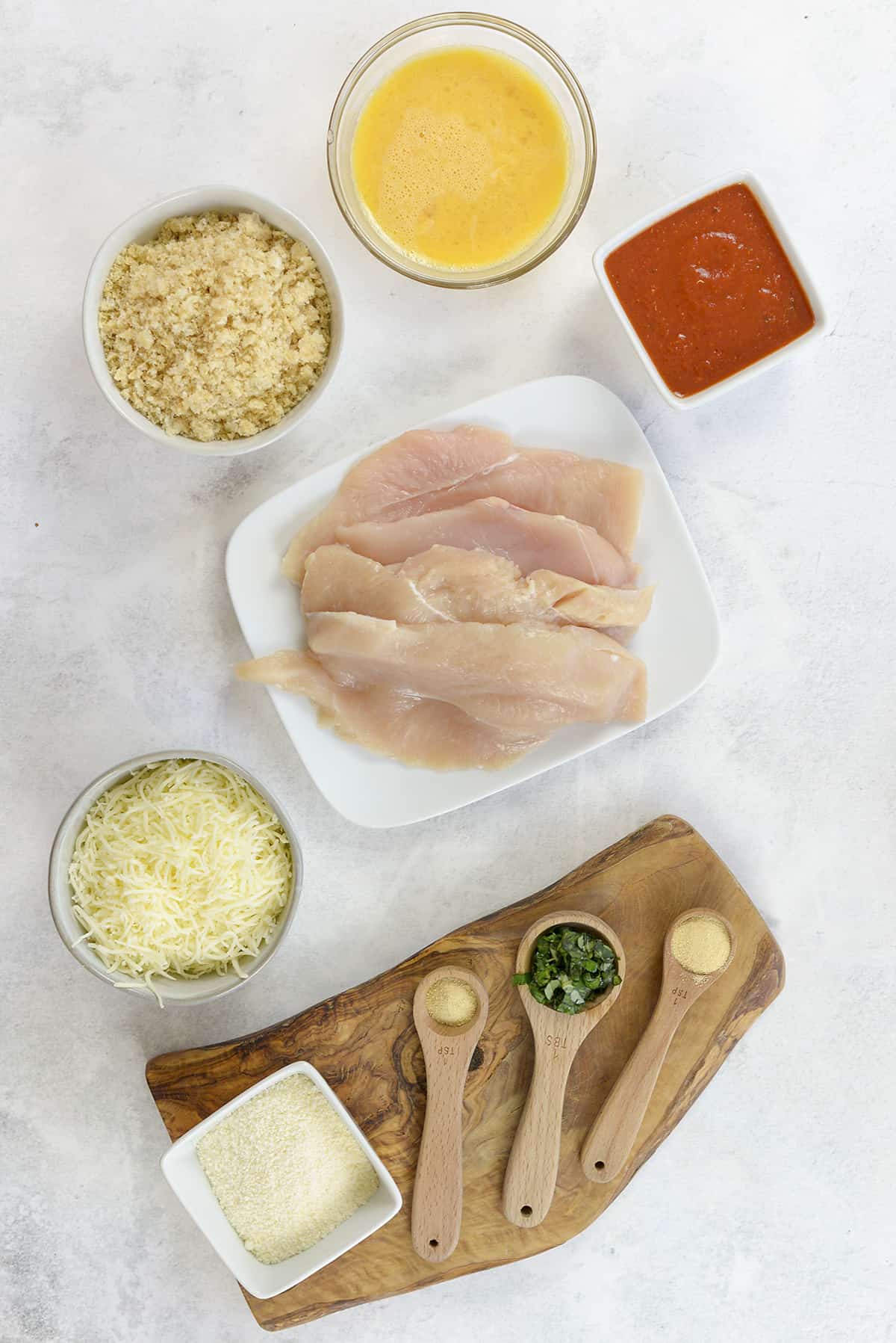 Ingredients for keto chicken parmesan made with pork rinds.