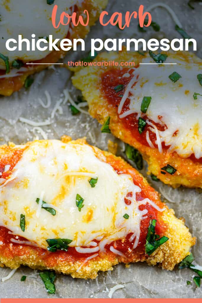 Baked chicken parmesan on pan.