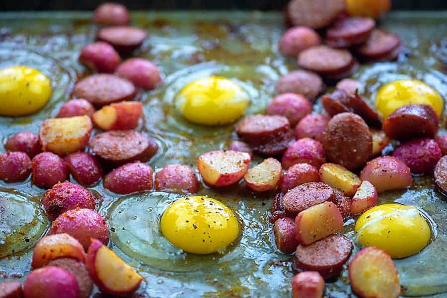 fried eggs in the oven with radishes and sausages