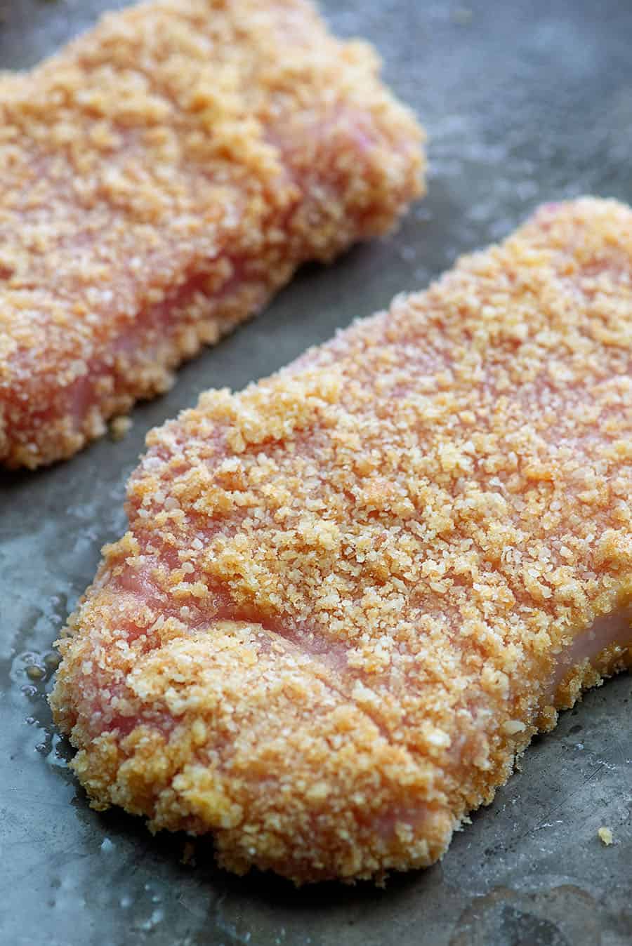 low carb breaded pork chops on baking sheet