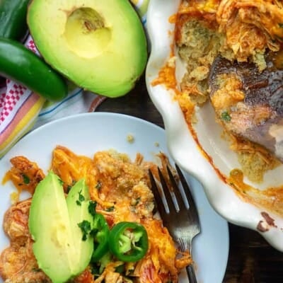 chicken sliced avocado and jalapeno on a white plate