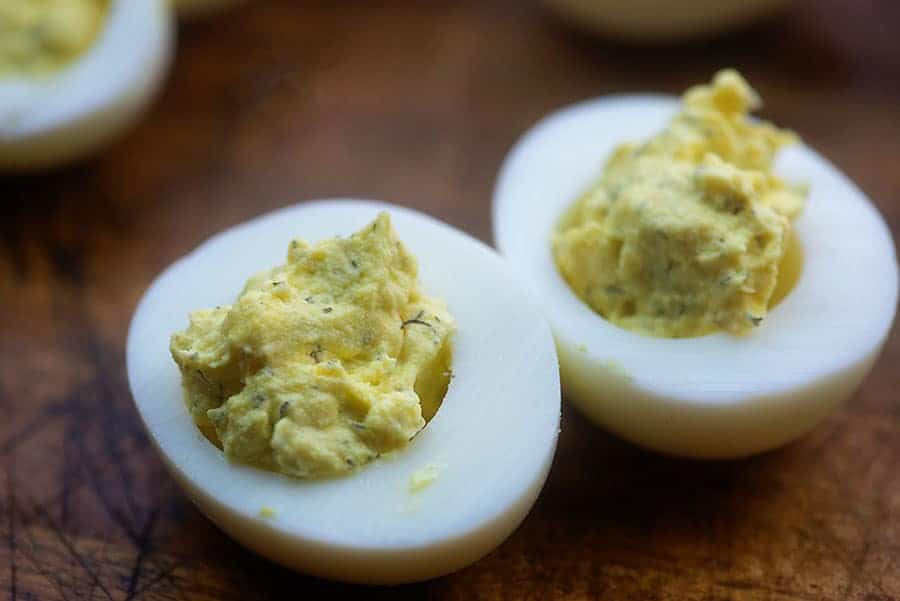 deviled eggs on cutting board