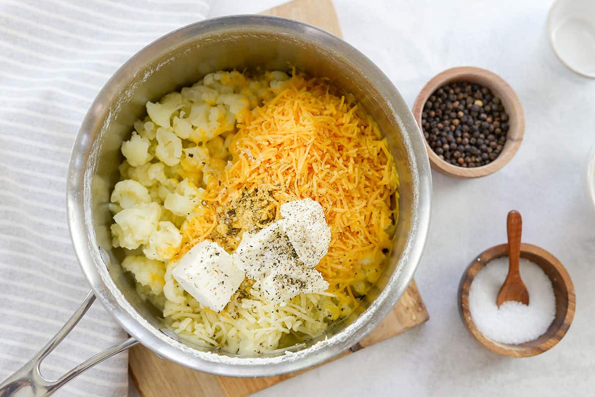cauliflower and cheese in sauce pan.