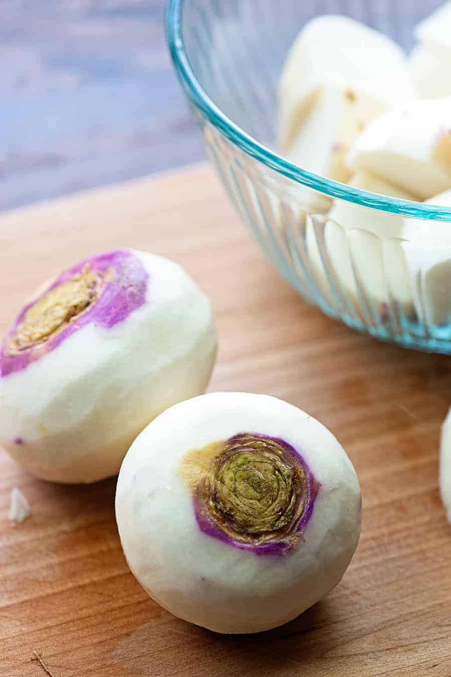 peeled turnips on cutting board