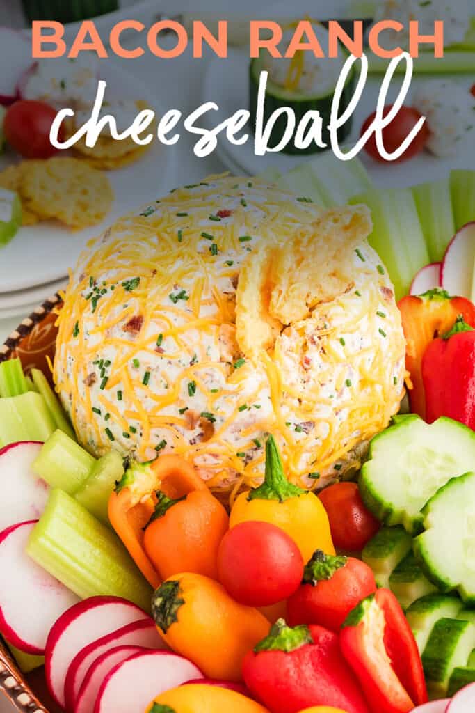 Bacon ranch cheese ball with vegetables and cheese whisps.