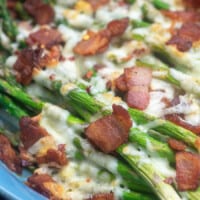 baked asparagus topped with cheese and bacon.