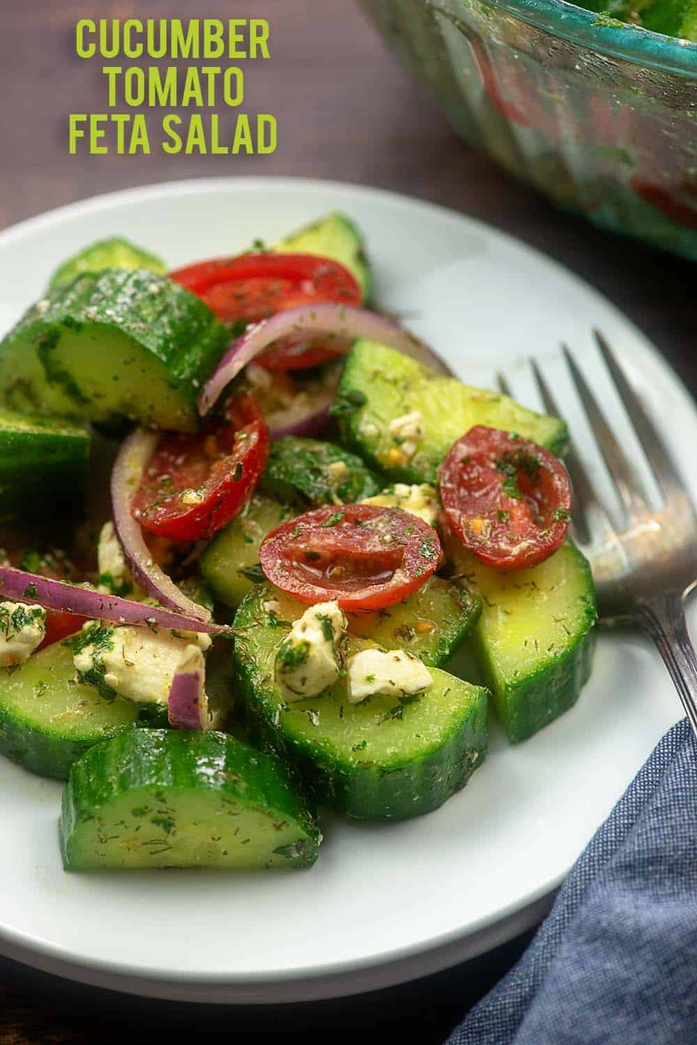 Cucumber Tomato Salad recipe on white plate