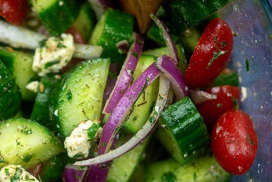 cucumber and tomato salad recipe in glass bowl