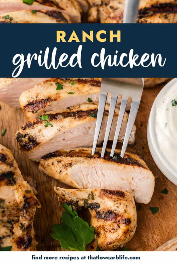 Fork stabbing a piece of grilled chicken.
