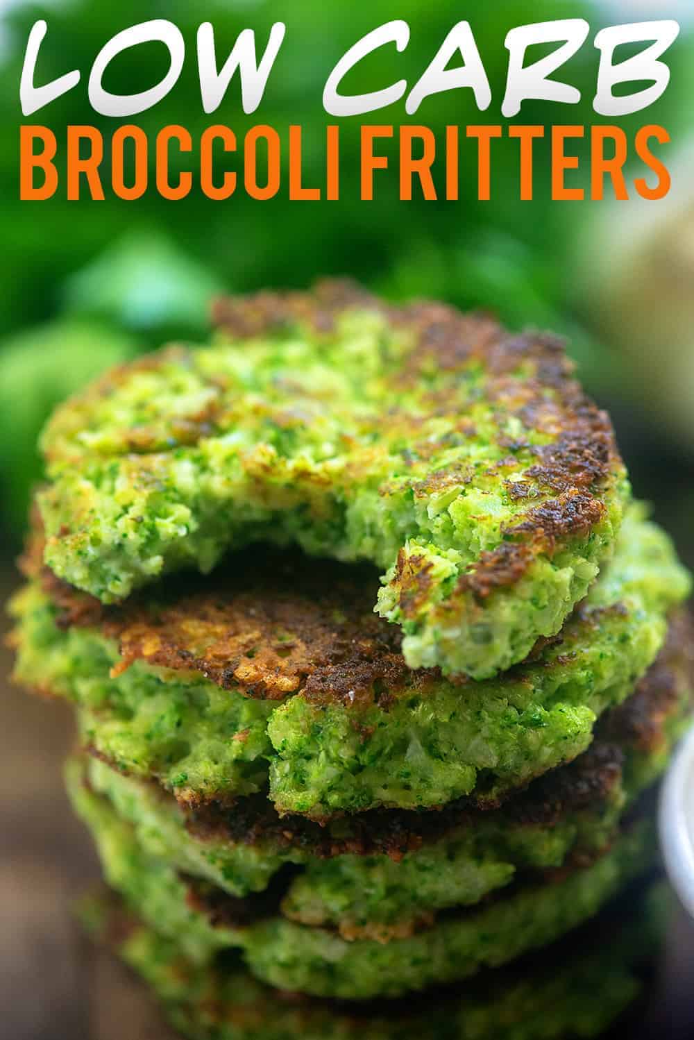 Stacked broccoli fritters with a bite out of the top one.