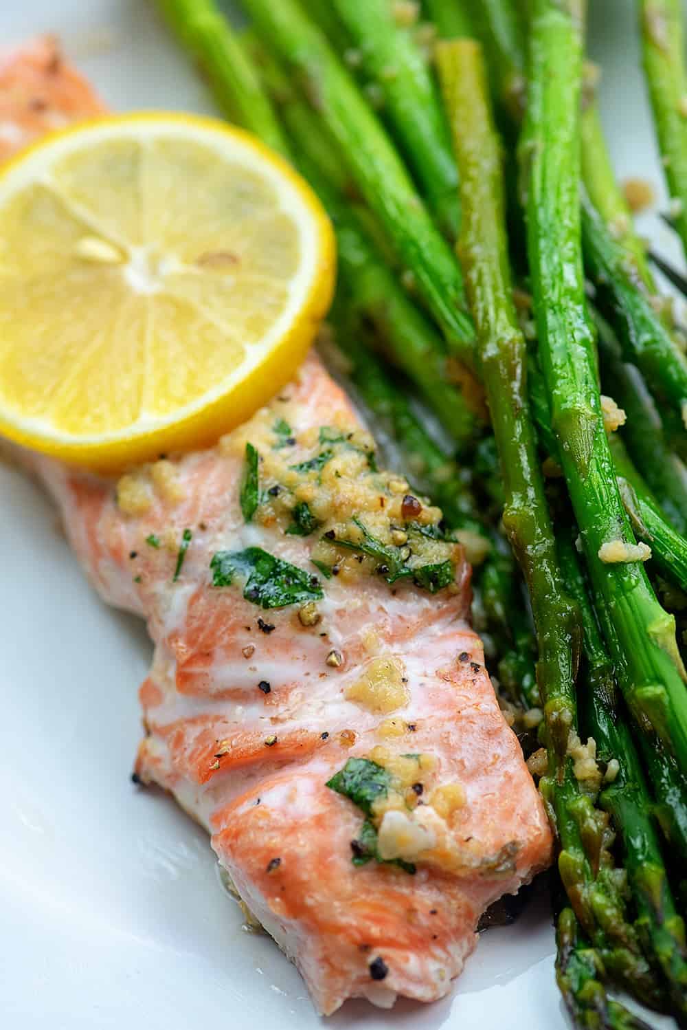 Overhead view of salmon and asparagus on a plate.