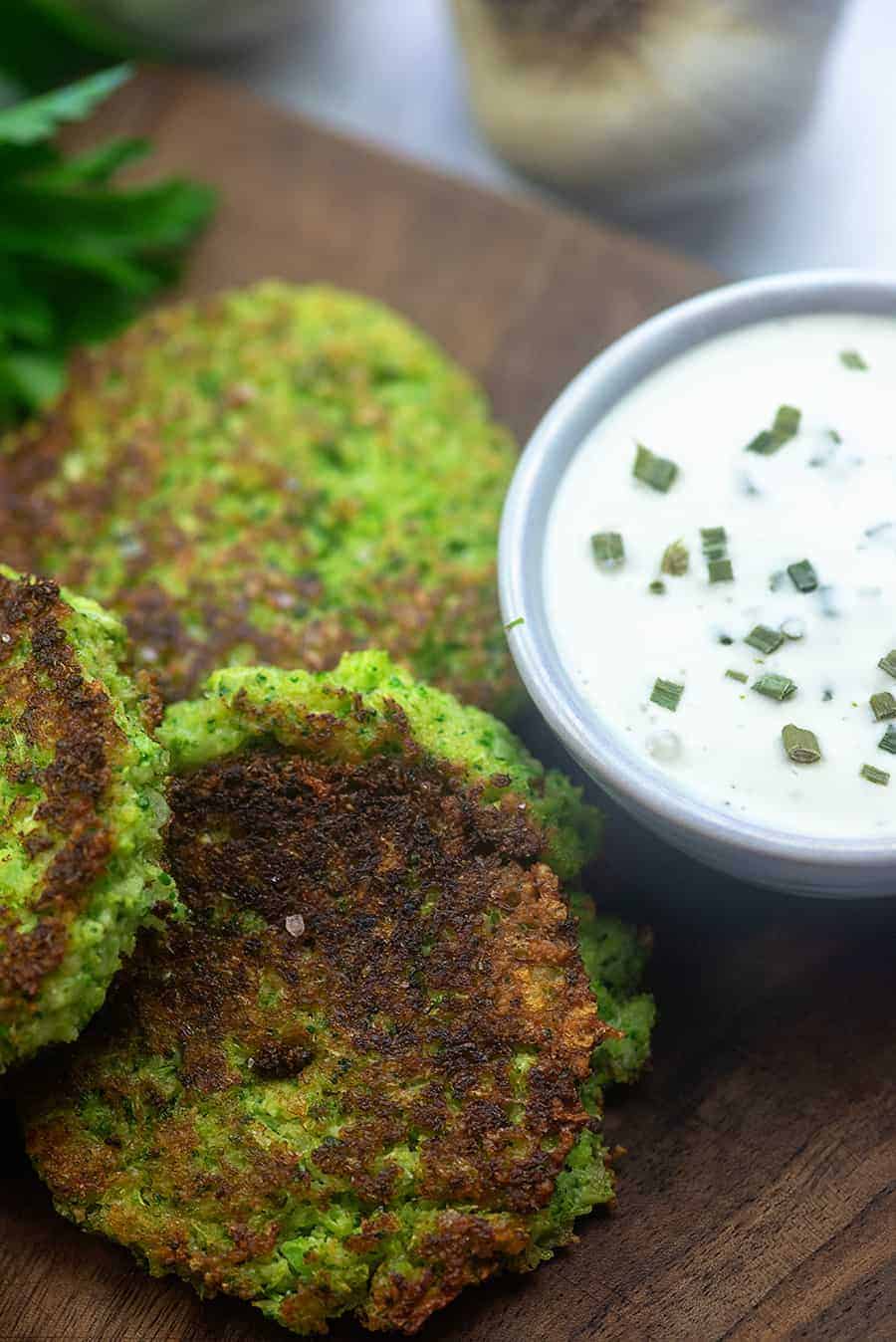 broccoli fritters on wooden cutting board.