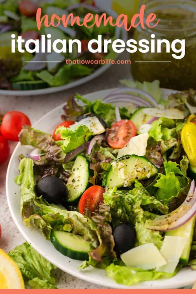 Plate full of green salad topped with keto Italian dressing recipe.