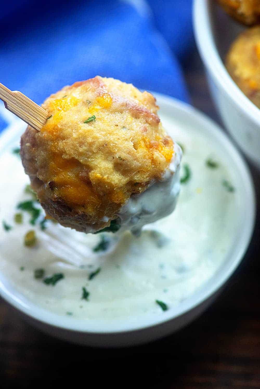 meatball on a toothpick being dipped into ranch dressing