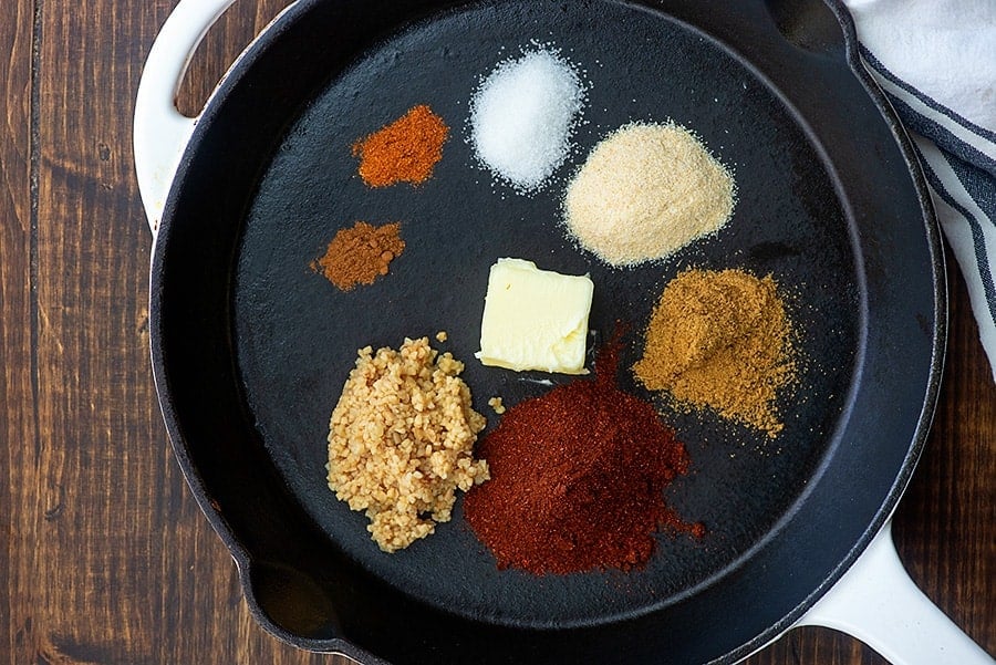 ingredients for gluten free enchilada sauce in skillet