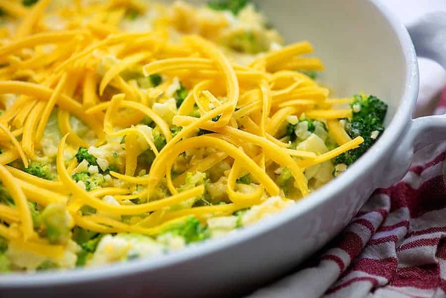 cheese and broccoli on a white bowl