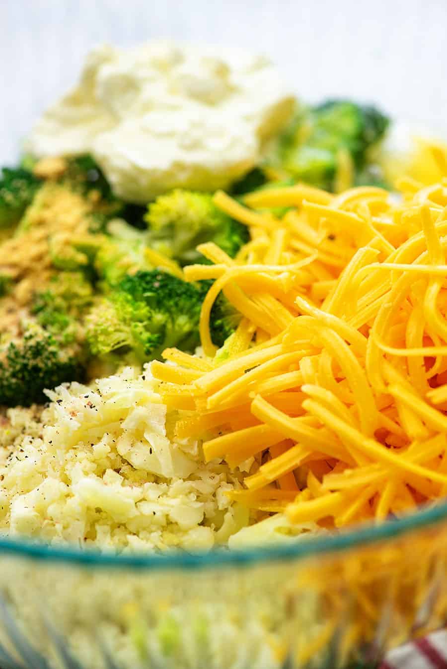 ingredients for broccoli rice casserole in glass bowl