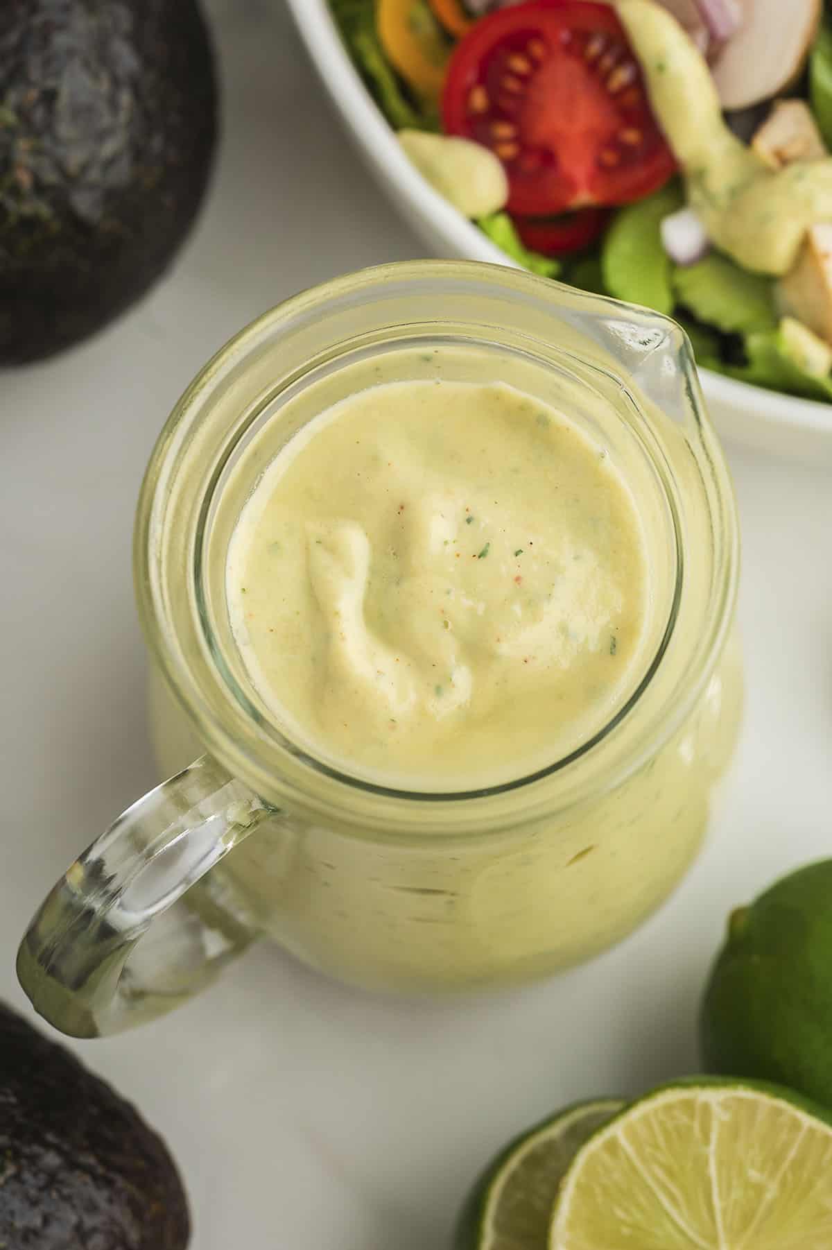 Avocado ranch salad dressing in small jar.