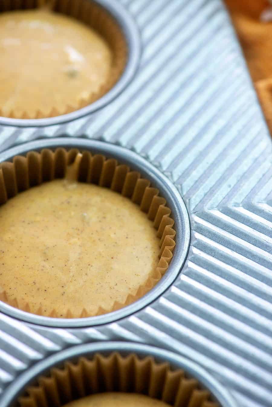 mini pumpkin cheesecake in muffin tin