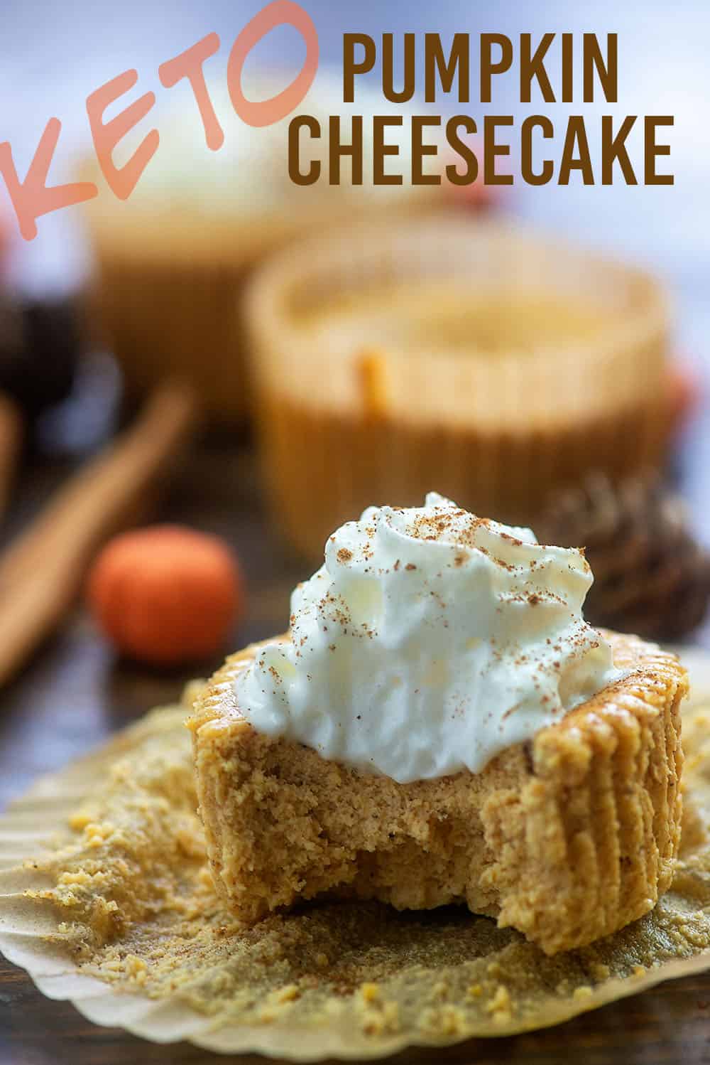 A close up of pumpkin cheesecake with a bite taken out of it.