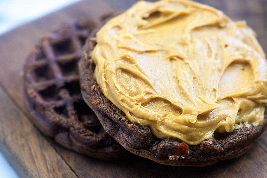 peanut butter spread out on a chocolate waffle