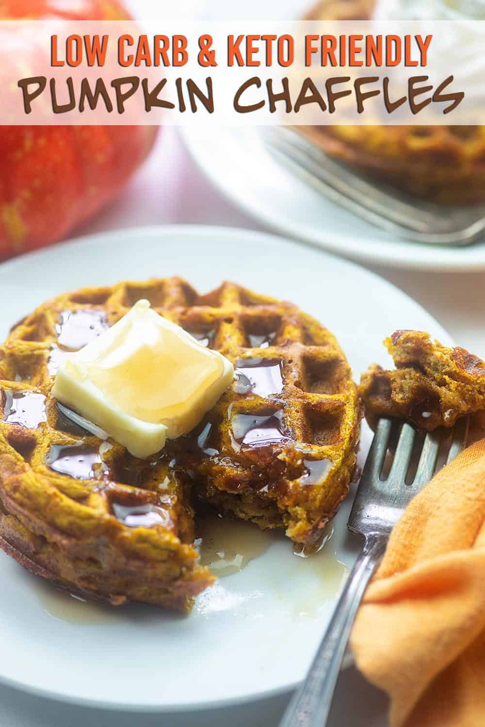 white plate with waffles on it with a cut taken out with a fork