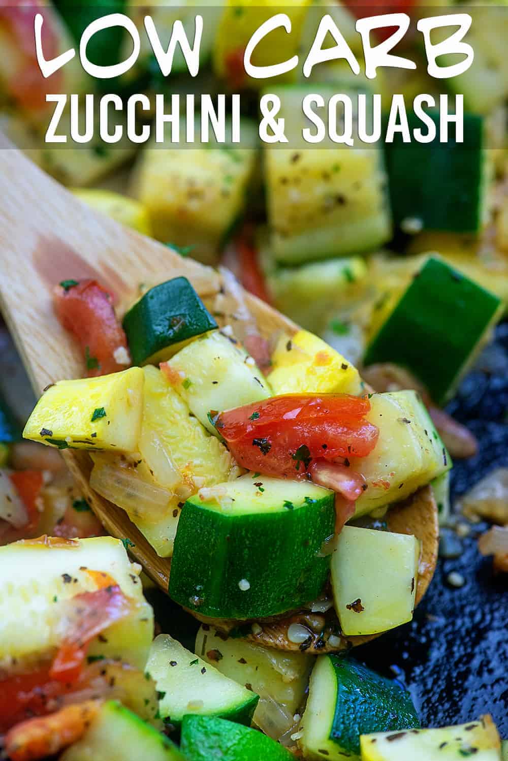 wooden spoon scooping sauteed zucchini and squash out of a cast iron skillet