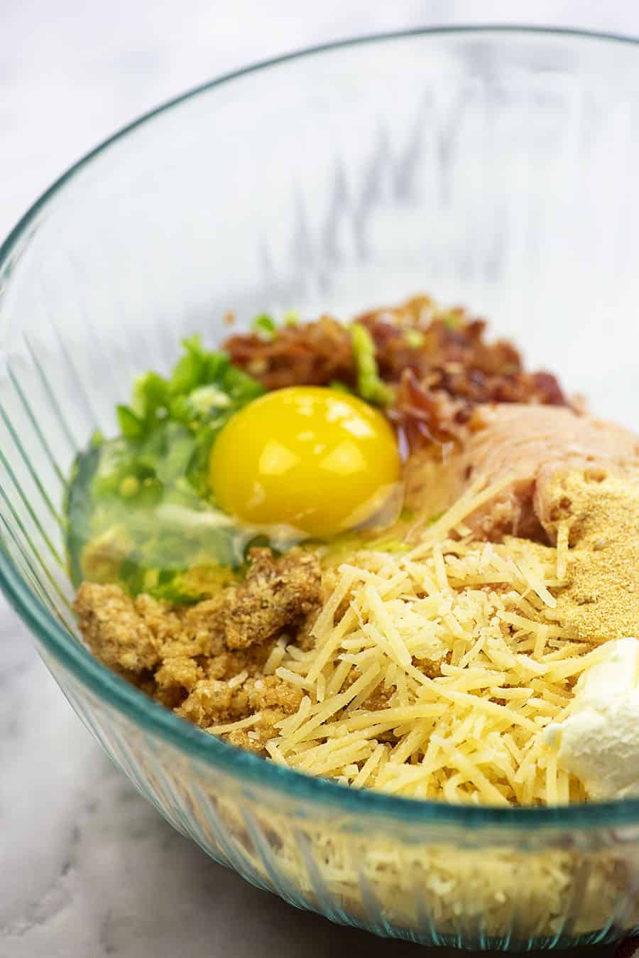 ingredients for spicy meatballs in glass bowl