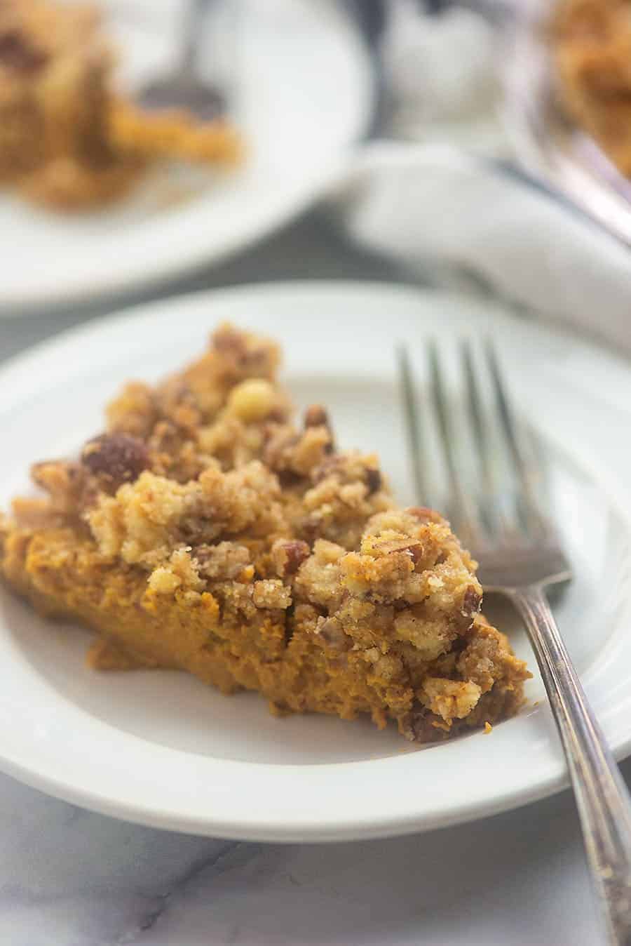 A close up of a plate of pumpkin pie