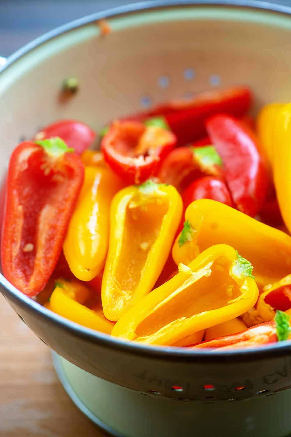mini sweet peppers in a strainer