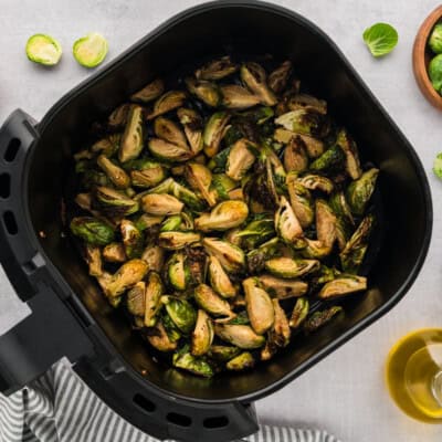 Brussels sprouts in air fryer basket.