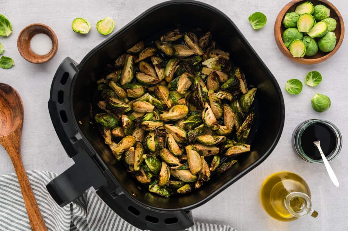 Brussels sprouts in air fryer basket.
