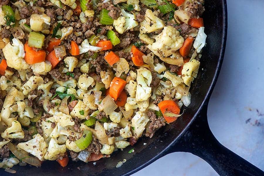 keto cauliflower stuffing in a cast iron skillet