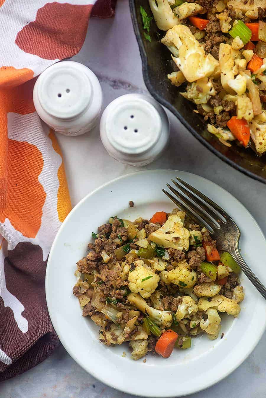 cauliflower stuffing next to a salt and pepper shaker