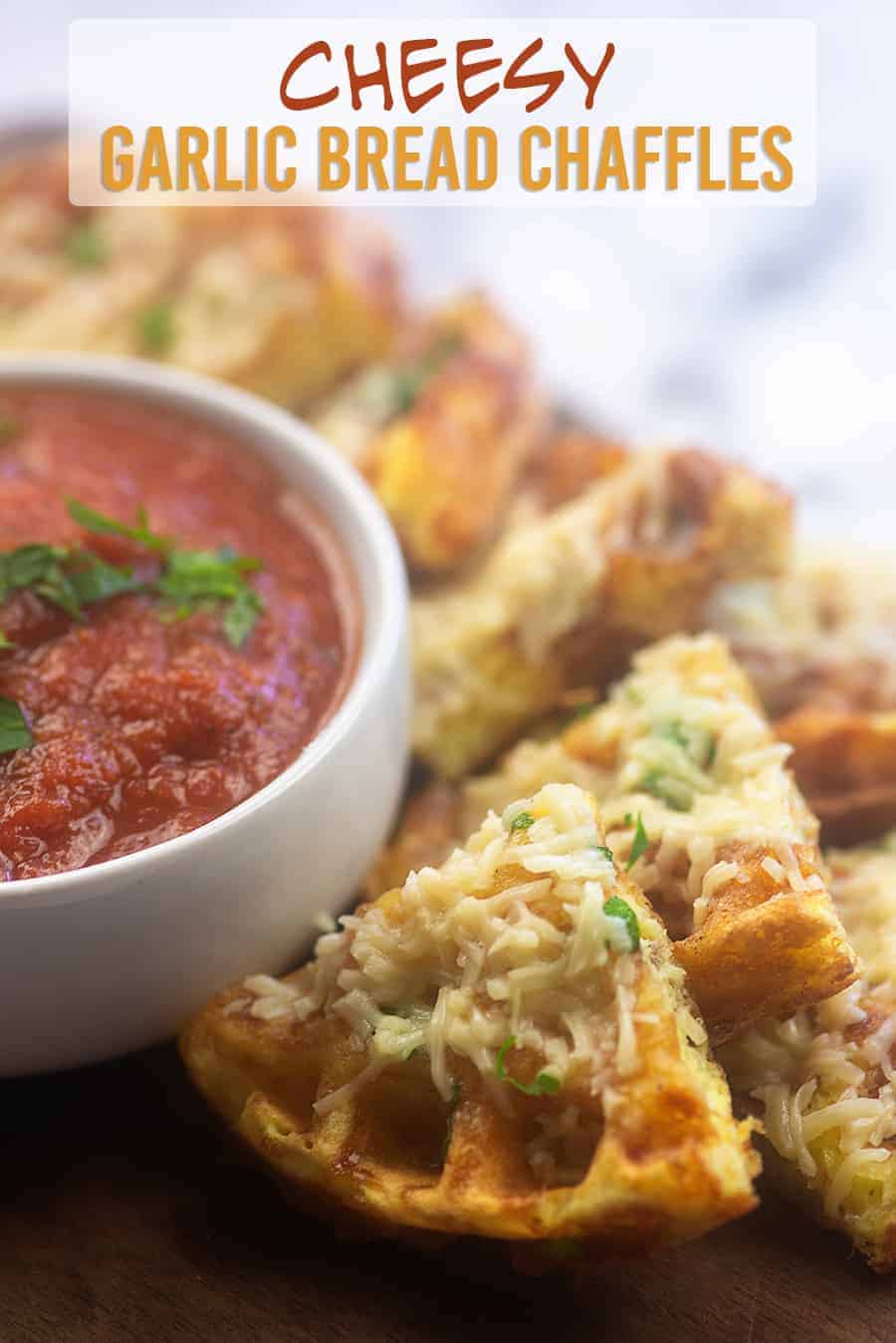 quarter chaffles next to a white dish of tomato sauce