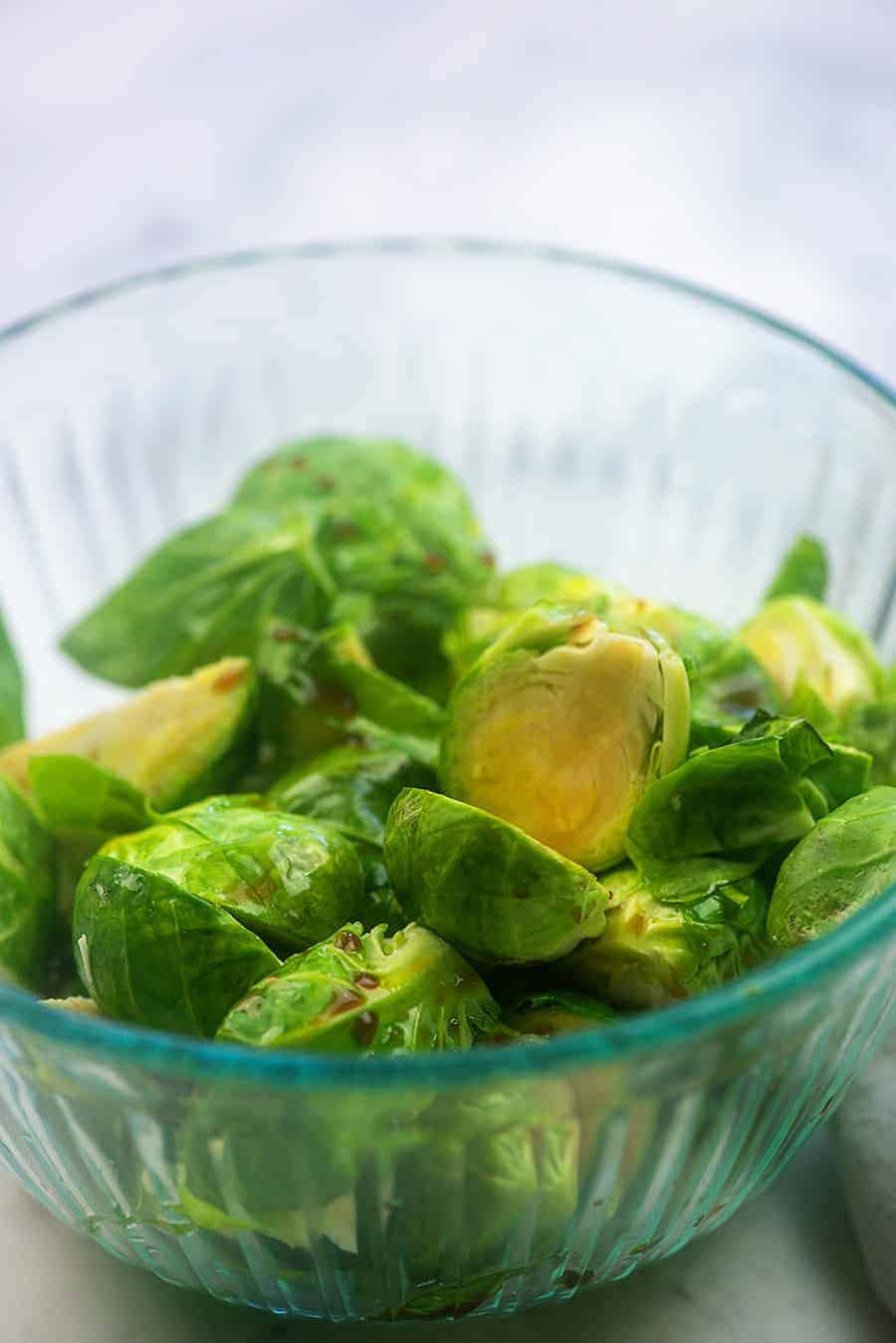 seasoned brussels sprouts in a glass bowl
