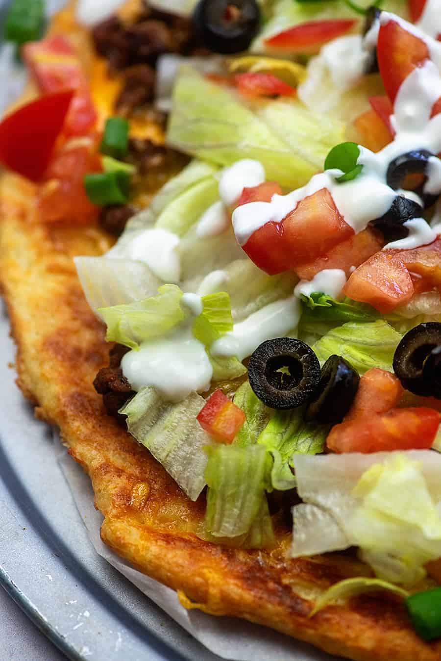 low carb taco pizza with sour cream on top