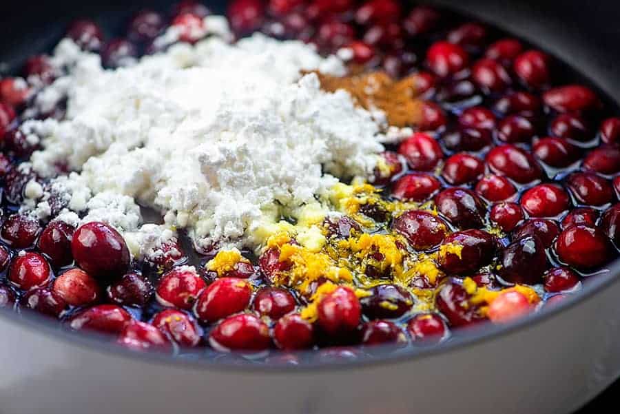 ingredients for keto cranberry sauce in saucepan