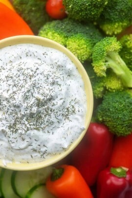 A bowl of food with broccoli, with Dip