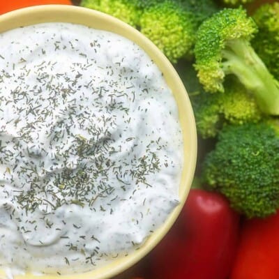 A bowl of food with broccoli, with Dip