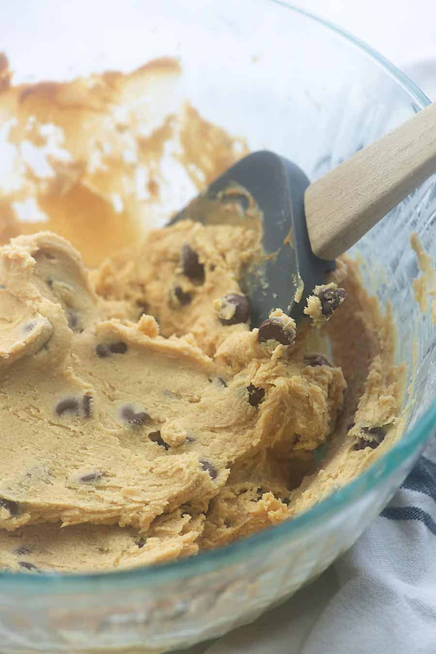 ingredients for low carb peanut butter balls in a glass bowl